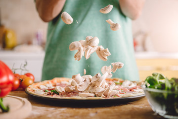 Woman preparing pizza