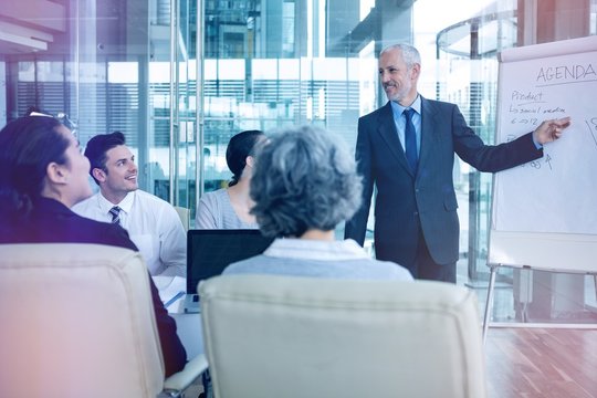 Businessman interacting with colleagues