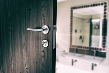 Fototapeta premium Composite image of closeup of door with doorknob