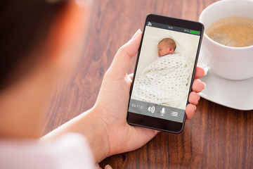 Person Hand Holding Babyphone
