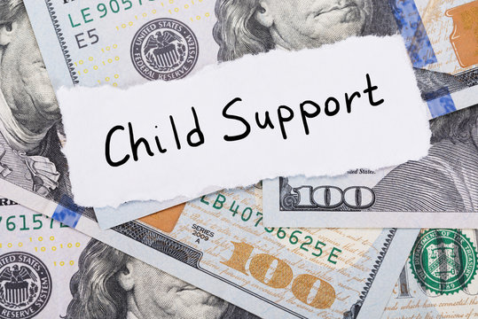 Child Support Note Placed On Top Of Dollar