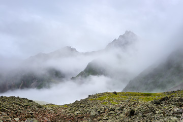 Mountain peaks shrouded cold mist