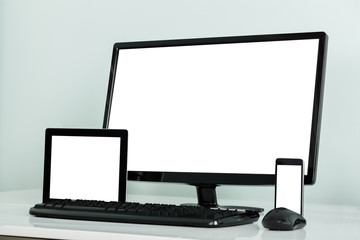 Computer Desktop With Digital Tablet And Mobilephone On Desk