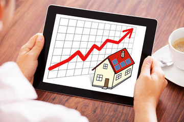 Rising Real Estate Agent Concept On Digital Tablet