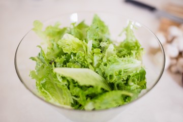 Leafy vegetable in bowl on worktop
