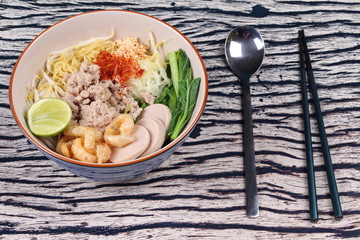 Two tone noodle ,white and yellow, with tom yum.