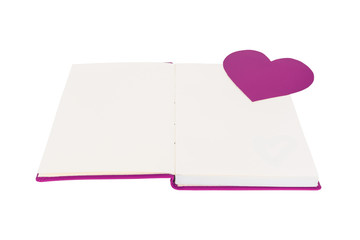 Paper heart on blank open book isolated on white background