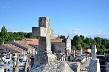Fototapeta na wymiar cross on a tombstone in a cemetery in France