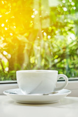 Hot coffee in white cup.