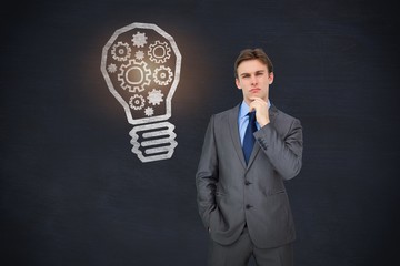 Composite image of thinking businessman