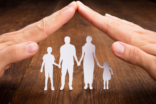Person Hand Protecting Family Papercut