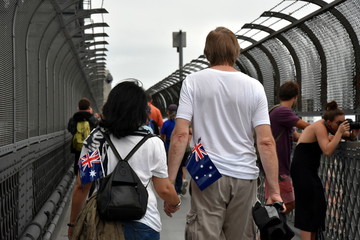 A couple celebrating Australia Day in Sydney. Australia flags in the bag.