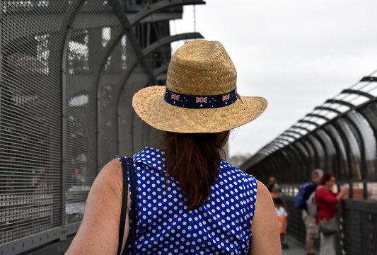 A lady celebrating Australia Day in Sydney. Australia flag decorates the hat.
