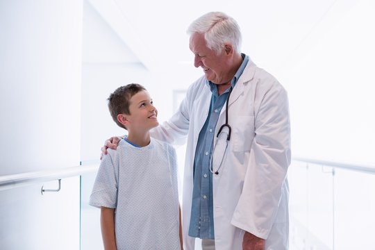 Doctor talking to boy patient