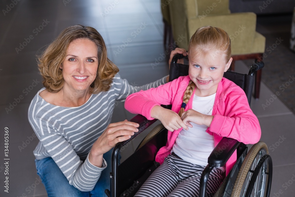 Poster Portrait of smiling woman and disabled girl