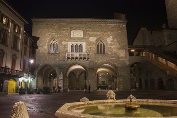 Bergamo - Old city (Citta Alta). One of the beautiful city in Italy. Lombardia. Landscape on the old main square (called Piazza Vecchia), the ancient Administration Headquarter and Contarini fountain.