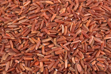 Heap of red rice isolated on white background
