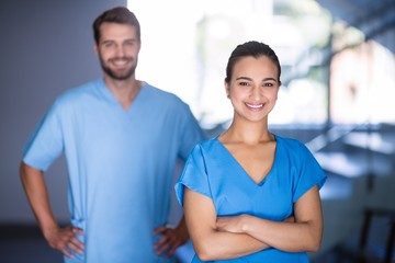 Portrait of doctors standing with arms crossed