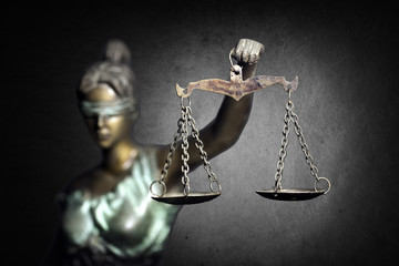 Lady Justice on dark background