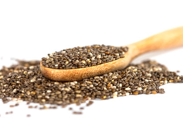 Close up chia seeds in wooden spoon on white background