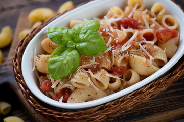 Close-up of italian pipe rigate pasta with tomatoes and cheese