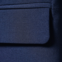 Navy blue cotton textile for background closeup of jacket pocket