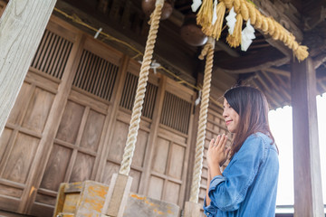 Woman pray in Japanese temple