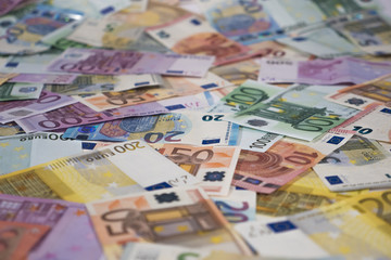 Obraz na płótnie Canvas Euro bills, background, side view, focus on middle ground, 4:3 ratio, shallow focus
