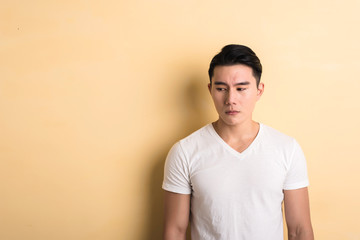 sad Asian young man