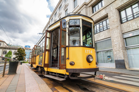 Vintage orange tram on the street of Milano near city center, Lombardia region, Italy. © Neonyn