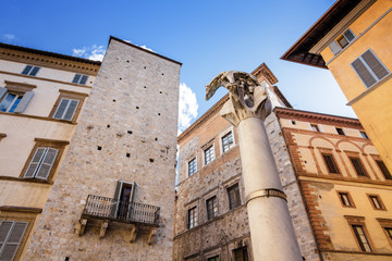 Sculpture Wolf with the cubs at column in Siena, Toscana region, Italy, Europe.