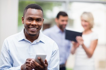 Fototapeta premium Portrait of a businessman using mobile phone