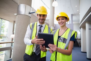 Architects holding digital tablet