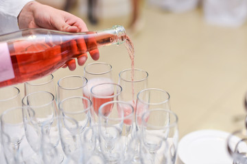 pouring water on a glass  white background