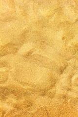 Beach sand closeup for background. Yellow sand macro photo