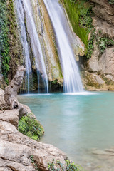 Fototapeta na wymiar Neda Waterfalls among the rocks and forest, Greece