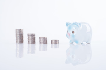 pile coin and piggy bank. concept saving finance and investment.