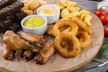 Beer snacks on wooden board