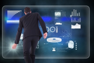 Composite image of rear view of businessman walking