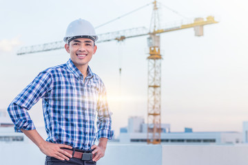 Portrait of architect wear a white helmet with construction site