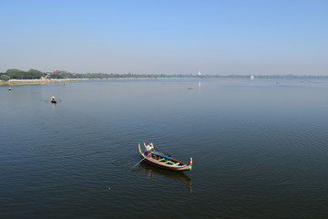 Fototapeta na wymiar Boats In Taungthaman Lake Near Amarapura, Myanmar