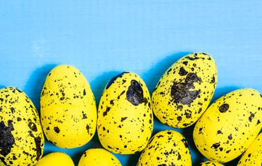Yellow easter eggs on wooden background