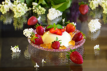 Italian dessert panna cotta with strawberries and  flowers