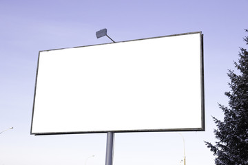 Blank billboard on street against sky