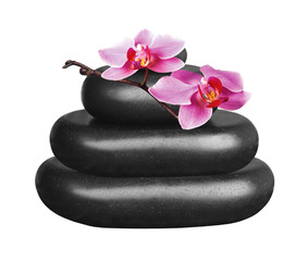 Black spa stones and pink orchid flower isolated on white