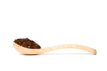 A chili flakes in a wooden spoon isolated over white background