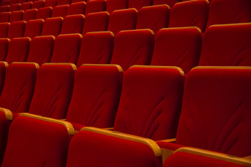 Empty red seats in concert hall