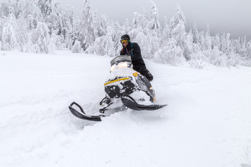 Athlete on a snowmobile