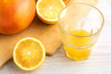 juice of citrus, lemon and grapefruit on a white background