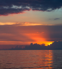sun rays with storm clouds on the sea.Sunset in Thailand